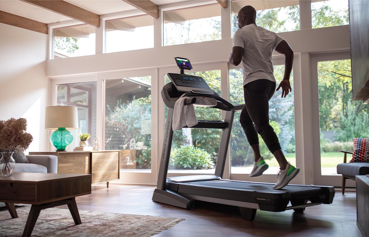 Man running on treadmill in home